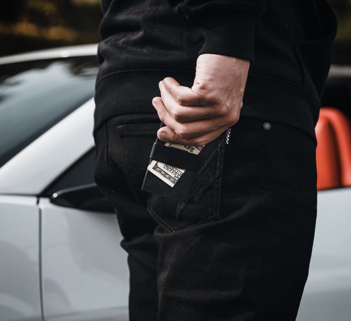 Man pulling his wallet out of his back pocket