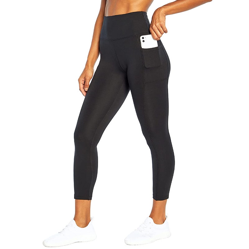 Bally Total Fitness High Rise Pocket Ankle Legging model wearing high-waisted cropped leggings on white background