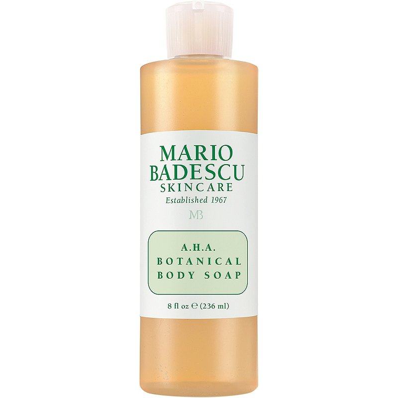 A clear plastic bottle of the amber-colored Mario Badescu A.H.A. Botanical Body Soap on a white background.