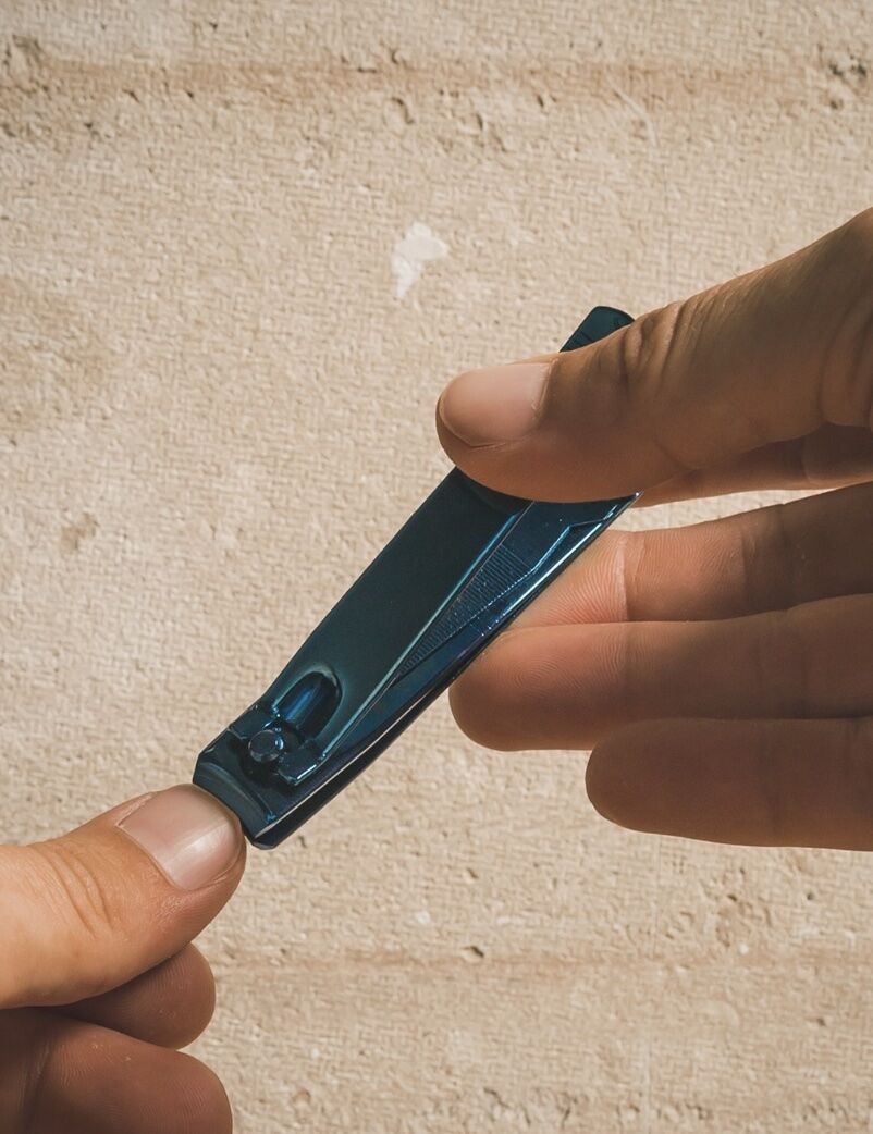 nail clippers being used