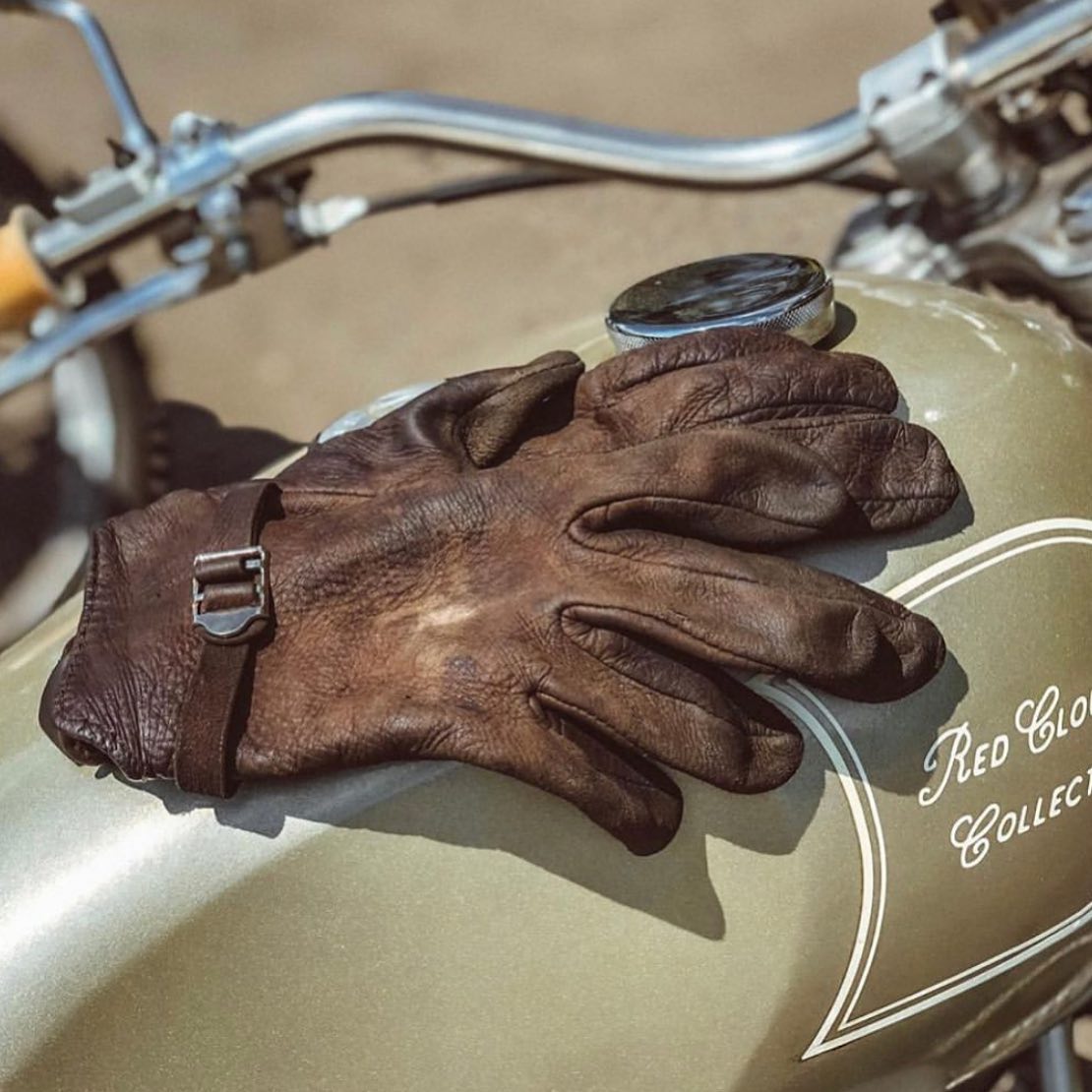 Brown leather gloves on a motorcycle