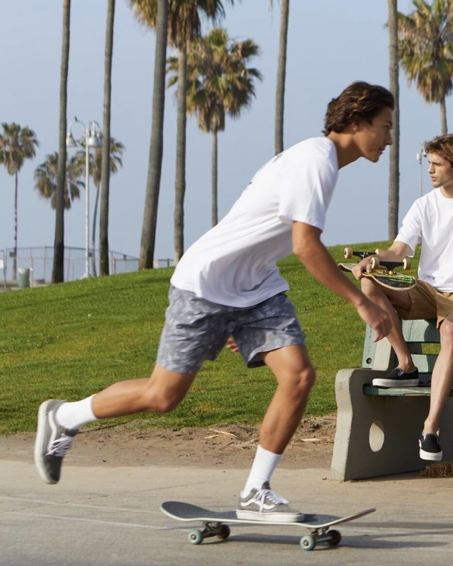 man in shorts skateboarding