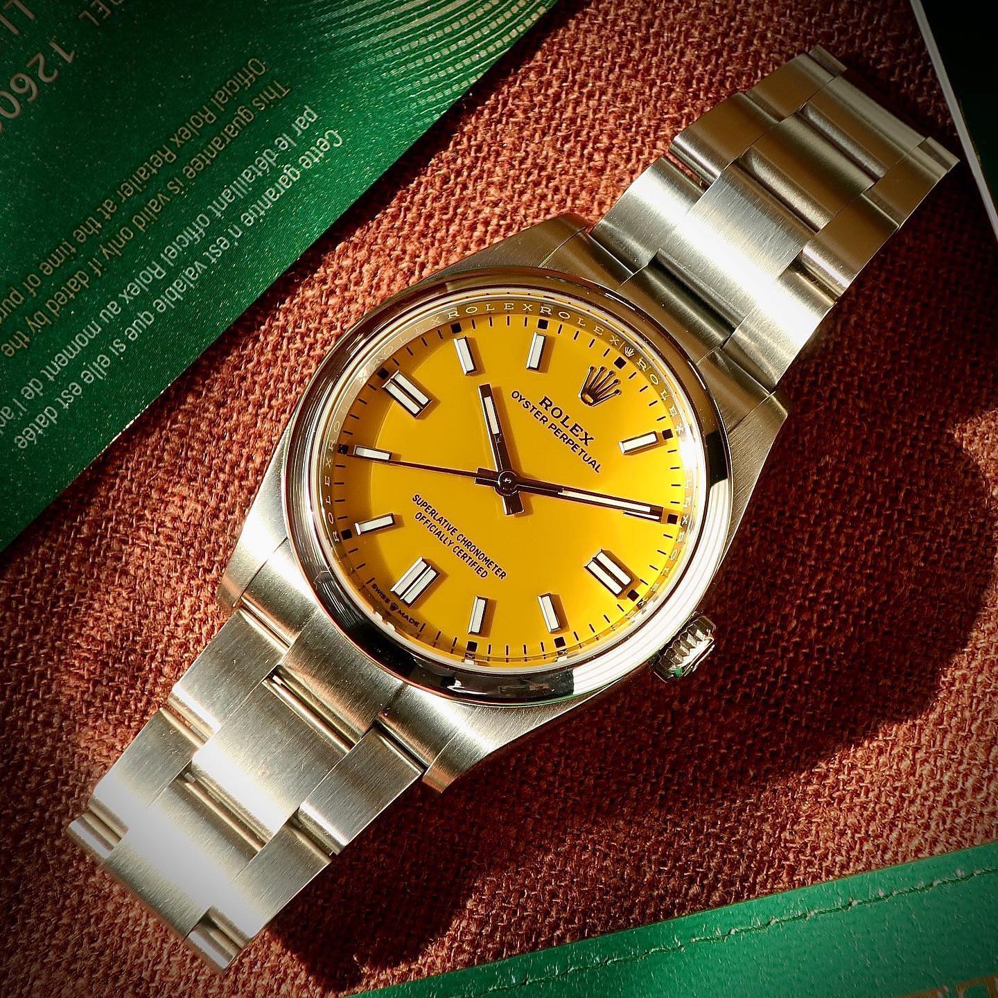 Close up photo of Rolex Oyster Perpetual Watch with Yellow Dial