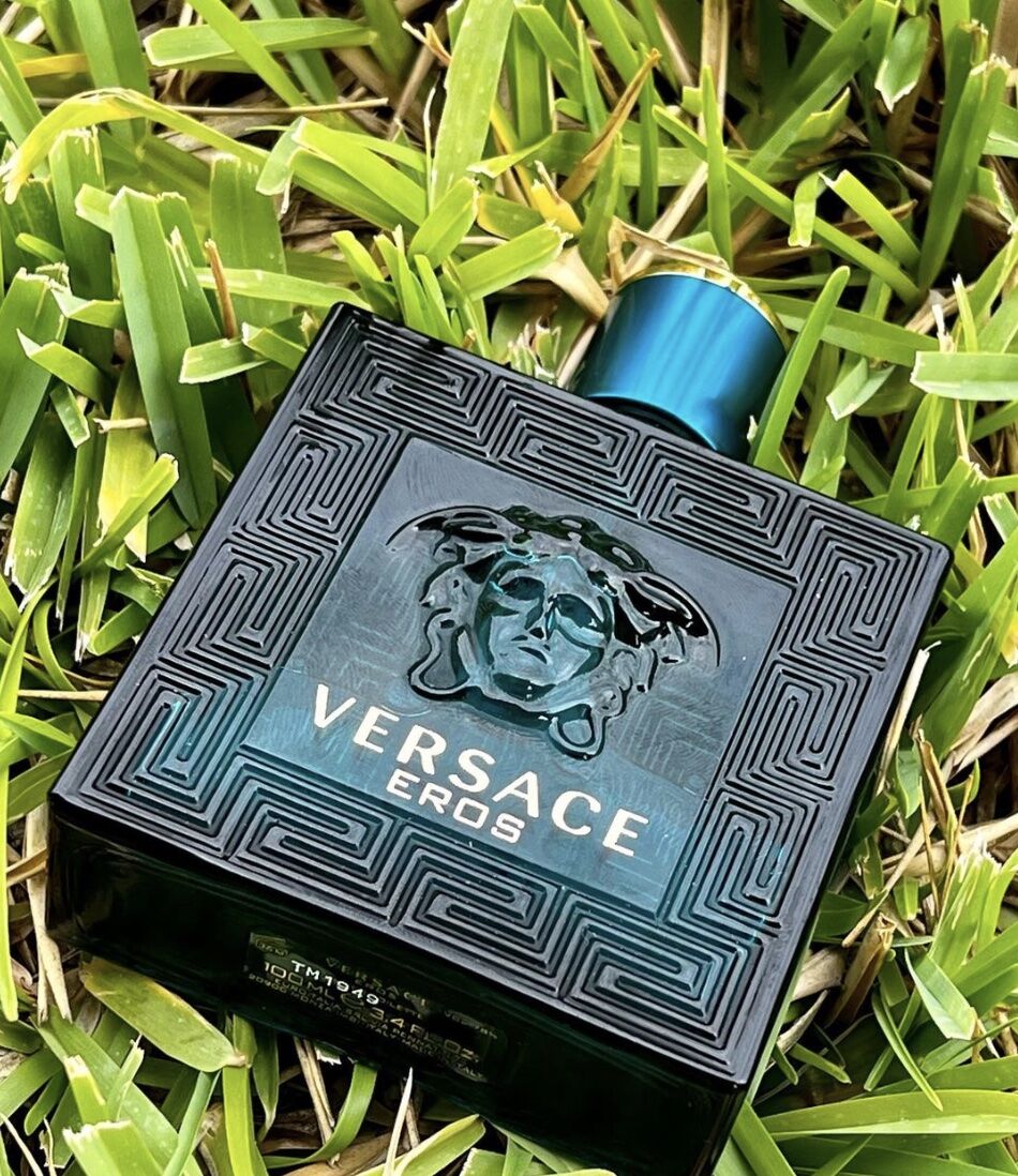 Bottle of Versace Cologne for Men in the grass