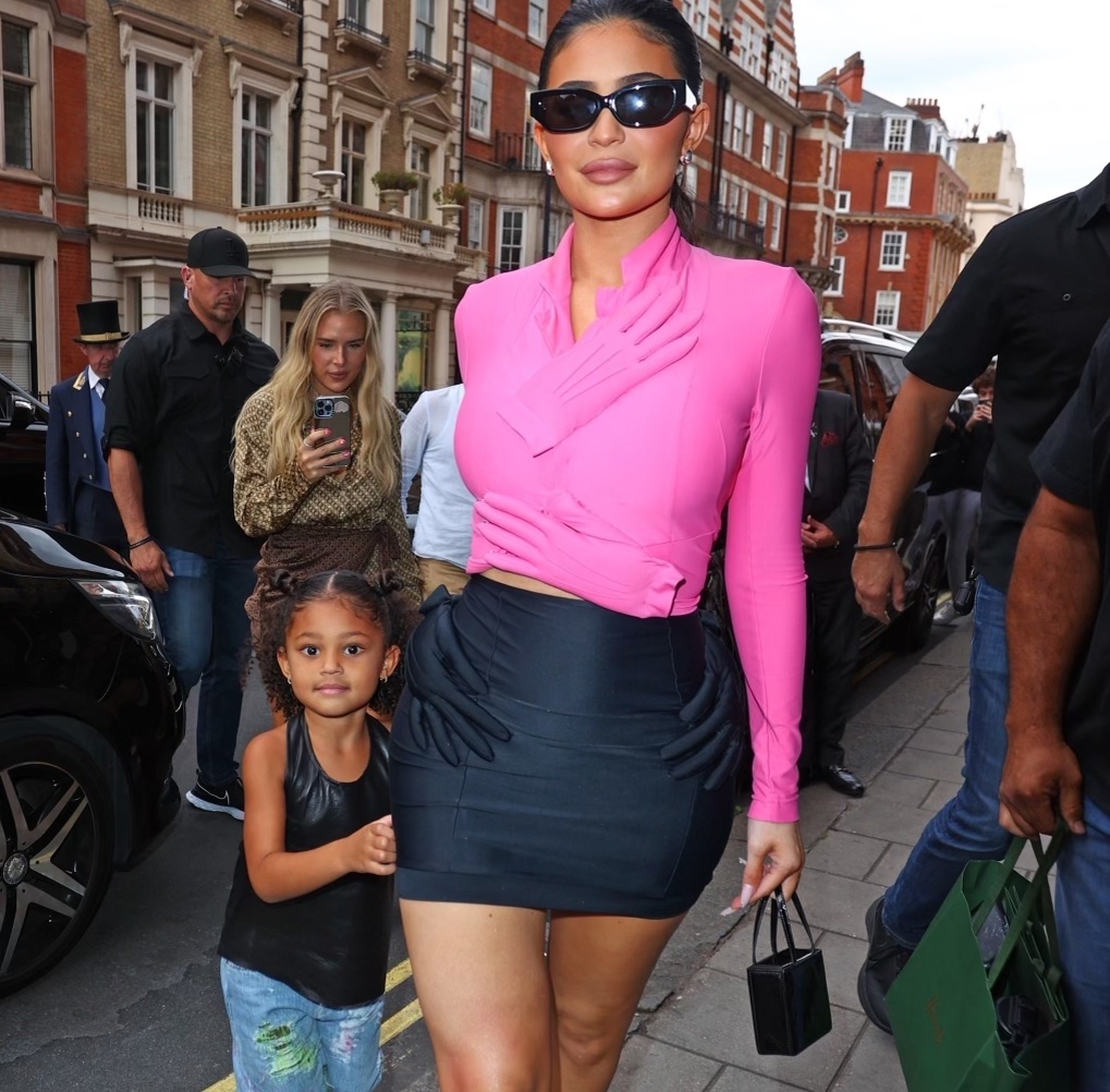 Kylie Jenner and Stormi Webster Spied Out in London in Pink and Black Hand Embellished Fall 2007 Comme Des Garcons Top and Skirt