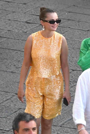 Capri, ITALY  - *EXCLUSIVE*  - American Singer Selena Gomez takes a stroll through town as she browses the shops during her holidays in Capri, Italy.  Selena out with her sequinned dress was seen with friends popping into the Prada designer store, as a rather smart-looking Italian–Canadian film producer Andrea Iervolino in his suit jacket joined Selena on the shopping spree. *Shot on August 3, 2022*  Pictured: Selena Gomez  BACKGRID USA 5 AUGUST 2022   BYLINE MUST READ: Cobra Team / BACKGRID  USA: +1 310 798 9111 / usasales@backgrid.com  UK: +44 208 344 2007 / uksales@backgrid.com  *UK Clients - Pictures Containing Children Please Pixelate Face Prior To Publication*