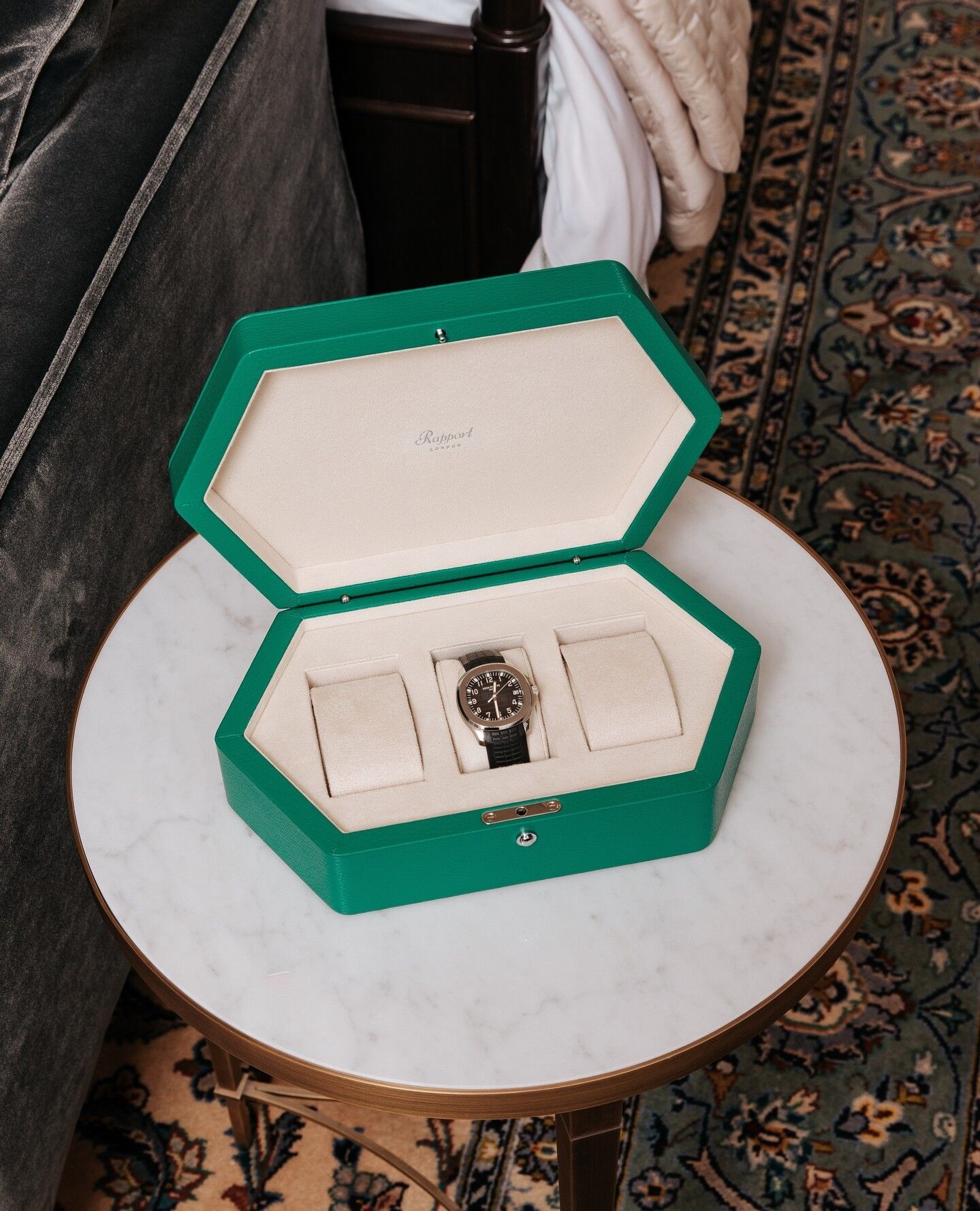 Watch in a green watch box