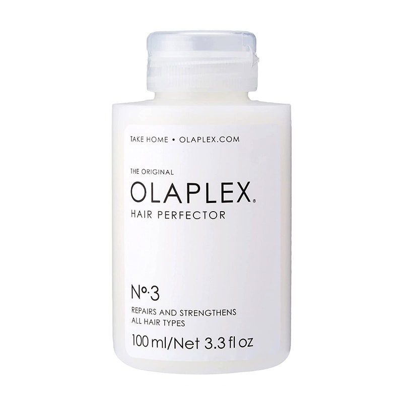 A white bottle of the Olaplex Hair Perfector No. 3 Repairing Treatment on a white background