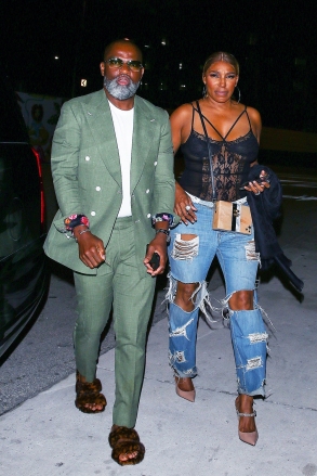 Miami, FL  - *EXCLUSIVE*  - NeNe Leakes and her boyfriend Nyonisela Sioh were seen arriving at Bar One restaurant for a dinner in Miami, Florida. NeNe looks casually chic in a lace body suit and baggy ripped jeans paired with heels.  Pictured: NeNe Leakes, Nyonisela Sioh  BACKGRID USA 9 MAY 2022   USA: +1 310 798 9111 / usasales@backgrid.com  UK: +44 208 344 2007 / uksales@backgrid.com  *UK Clients - Pictures Containing Children Please Pixelate Face Prior To Publication*