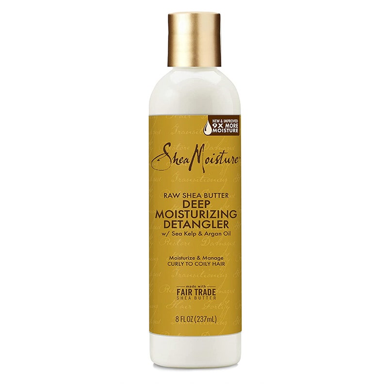 A gold bottle of the SheaMoisture Raw Shea Butter Deep Moisturizing Detangler on a white background