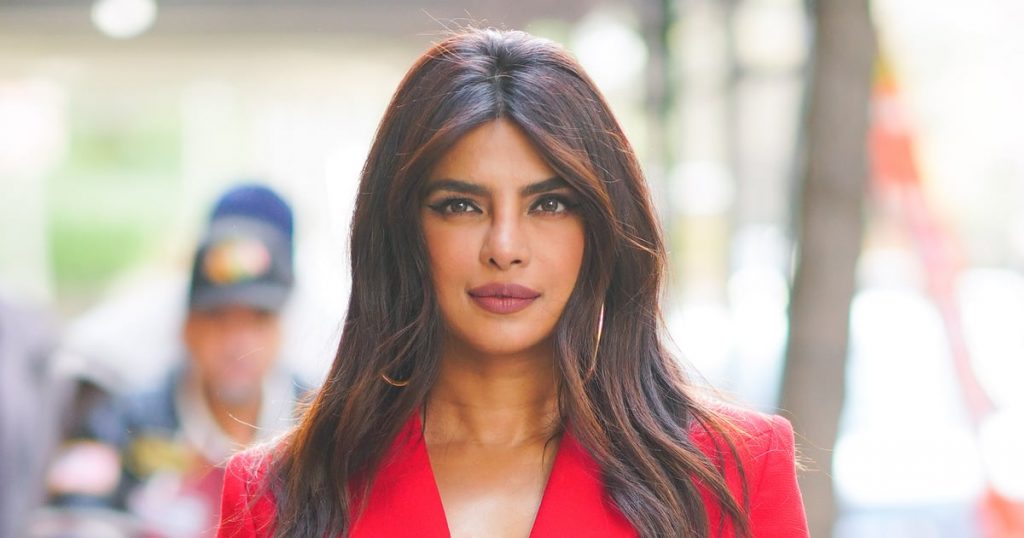 Priyanka Chopra Goes Bold in Plunging Red Dress at a Friend’s Wedding